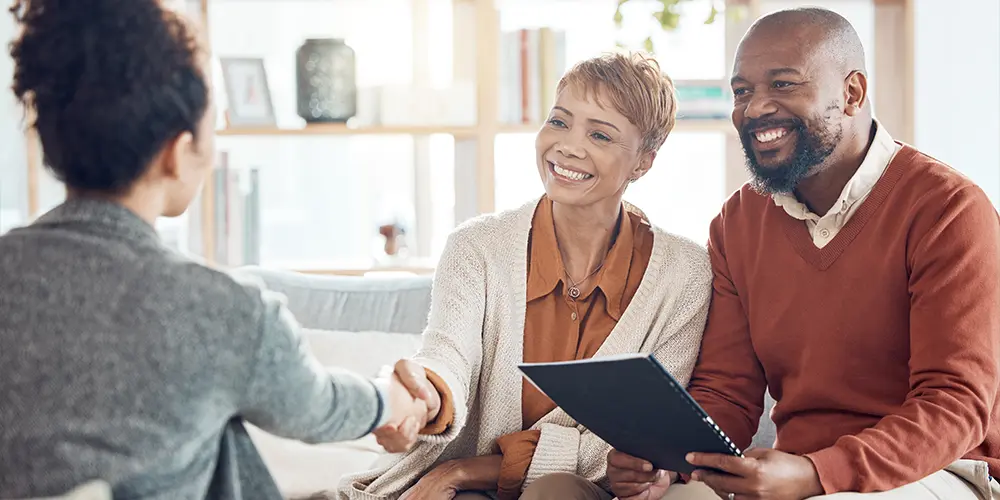 couple meeting with financial advisor to discuss the benefits of retirement annuities