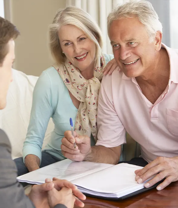 financial advisor meeting with clients to talk about retirement strategies
